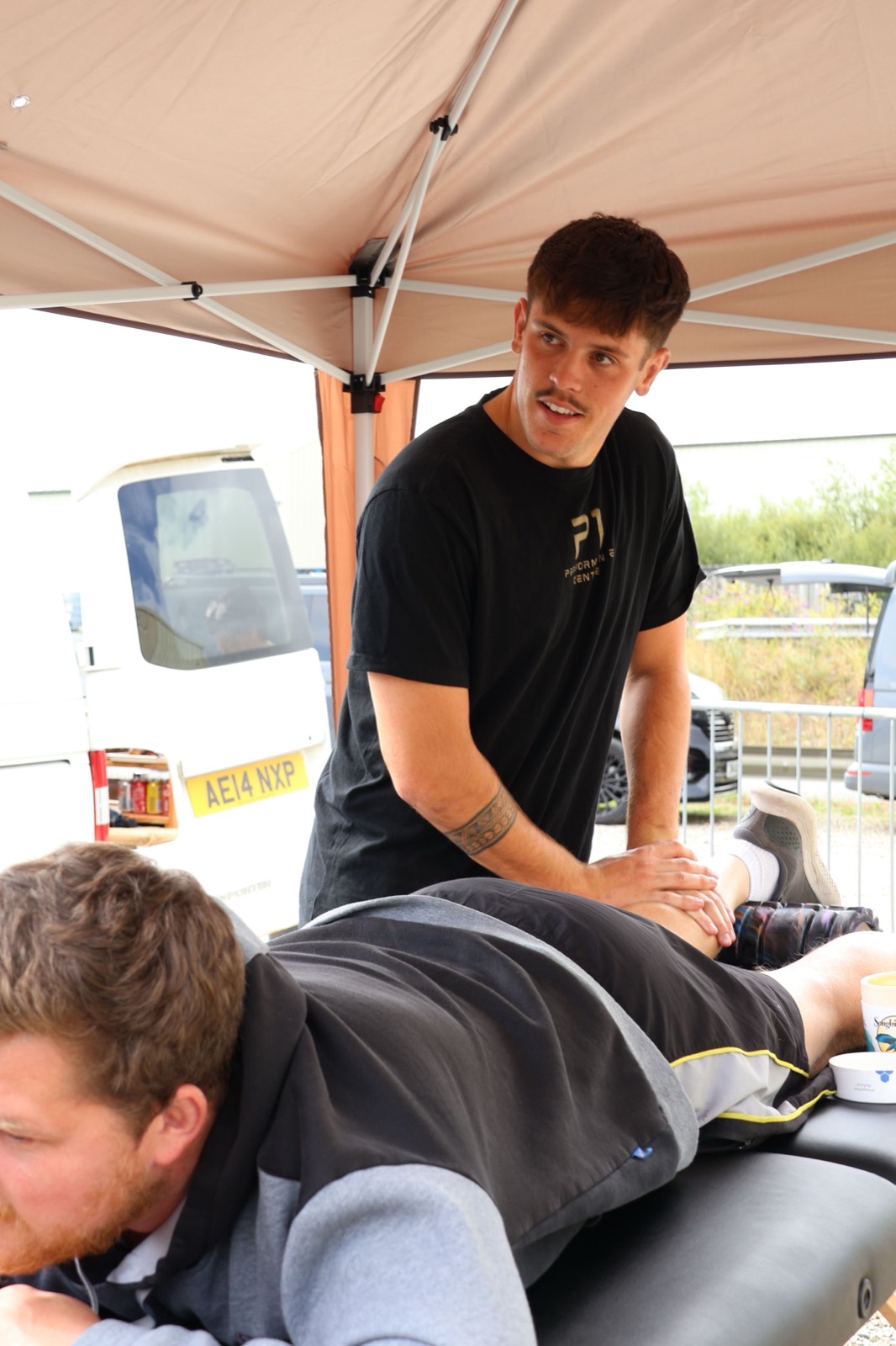 Iestyn treating a client's calf